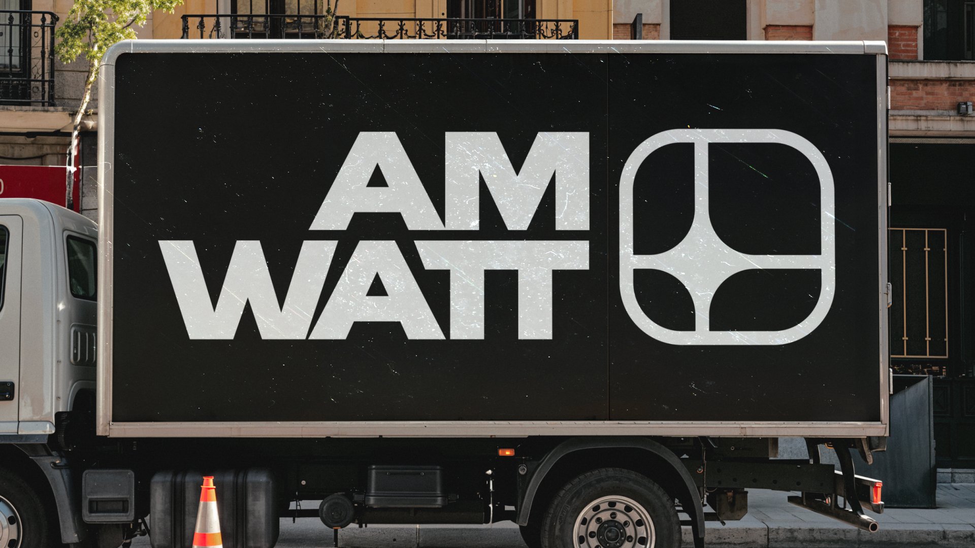 Yellow hard hat with the AM Watt logo