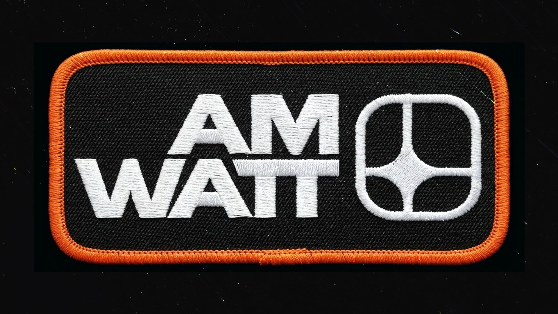 AM Watt embroidered patch with orange border on black