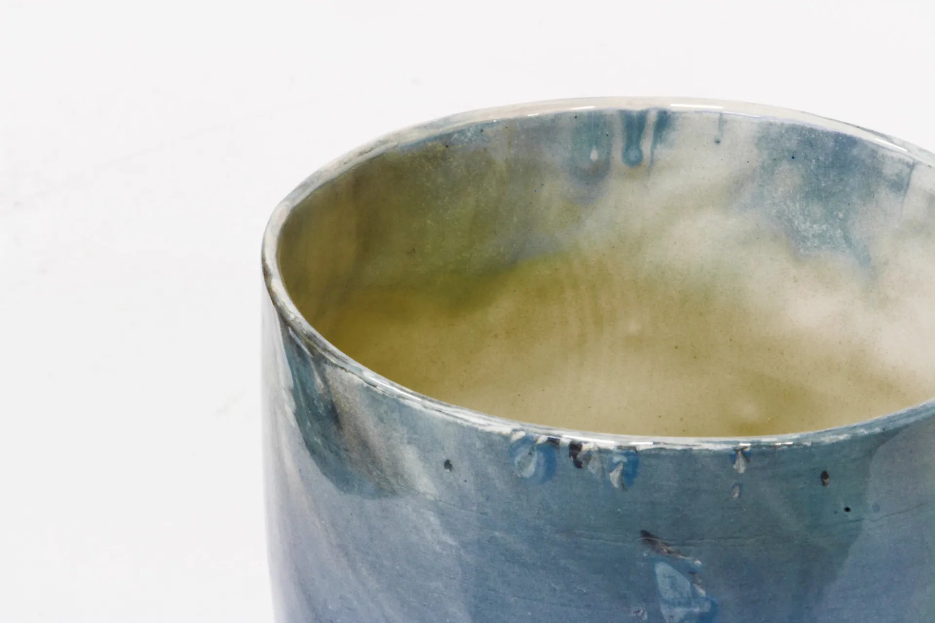 Close-up of a blue-glazed Bijzonder ceramic cup